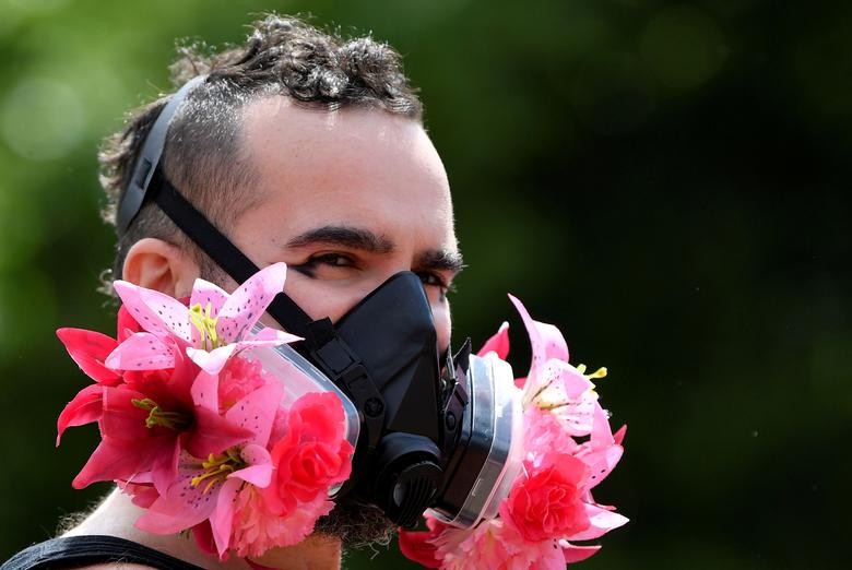 A participant wears a decorated face mask during a Black Trans Lives Matter rally in London, Britain. REUTERS/Toby Melville  